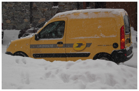 La Poste delivery van on a snowy road in Val Thorens