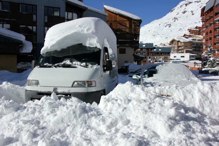 Snow-covered vehicles in Val Thorens